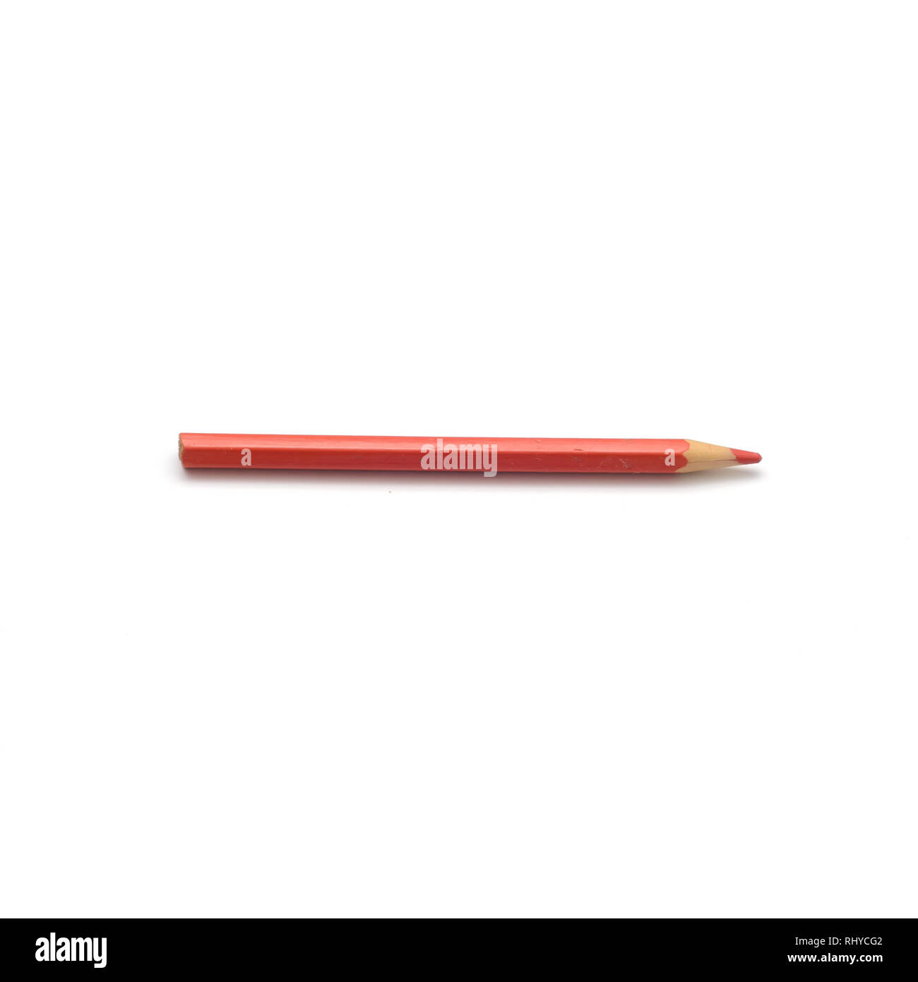 Sharpened Red crayon on a white background.Square cropping. Stock Photo
