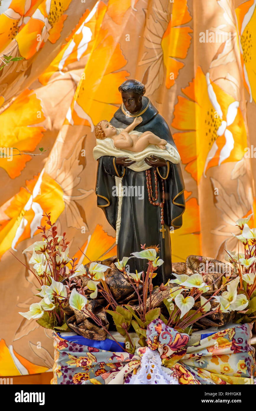 Saint Benedict, black-skinned saint carrying a child and traditional of the faith and Catholic religion of Brazil Stock Photo