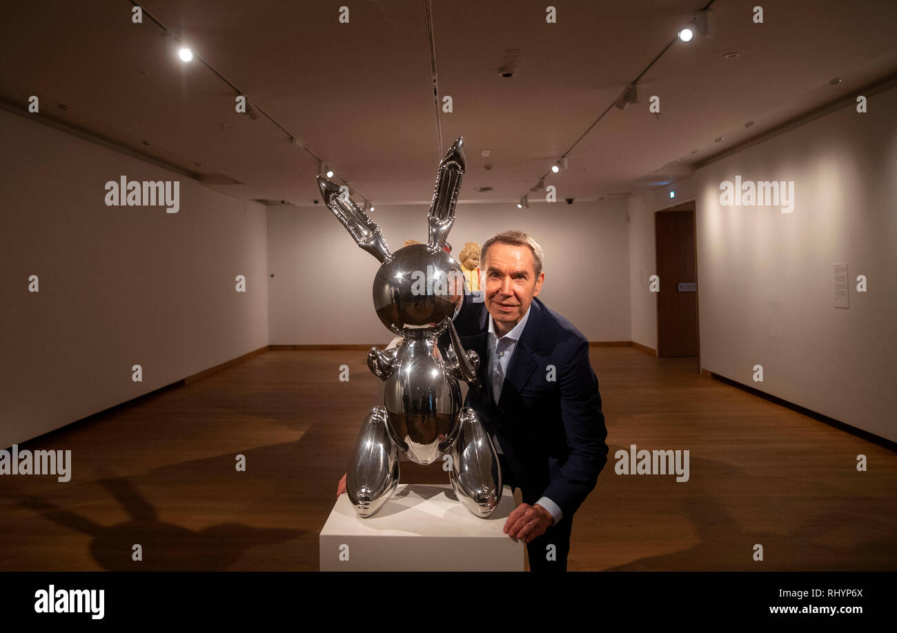 Artist Jeff Koons poses next to his piece called Rabbit during a photo ...