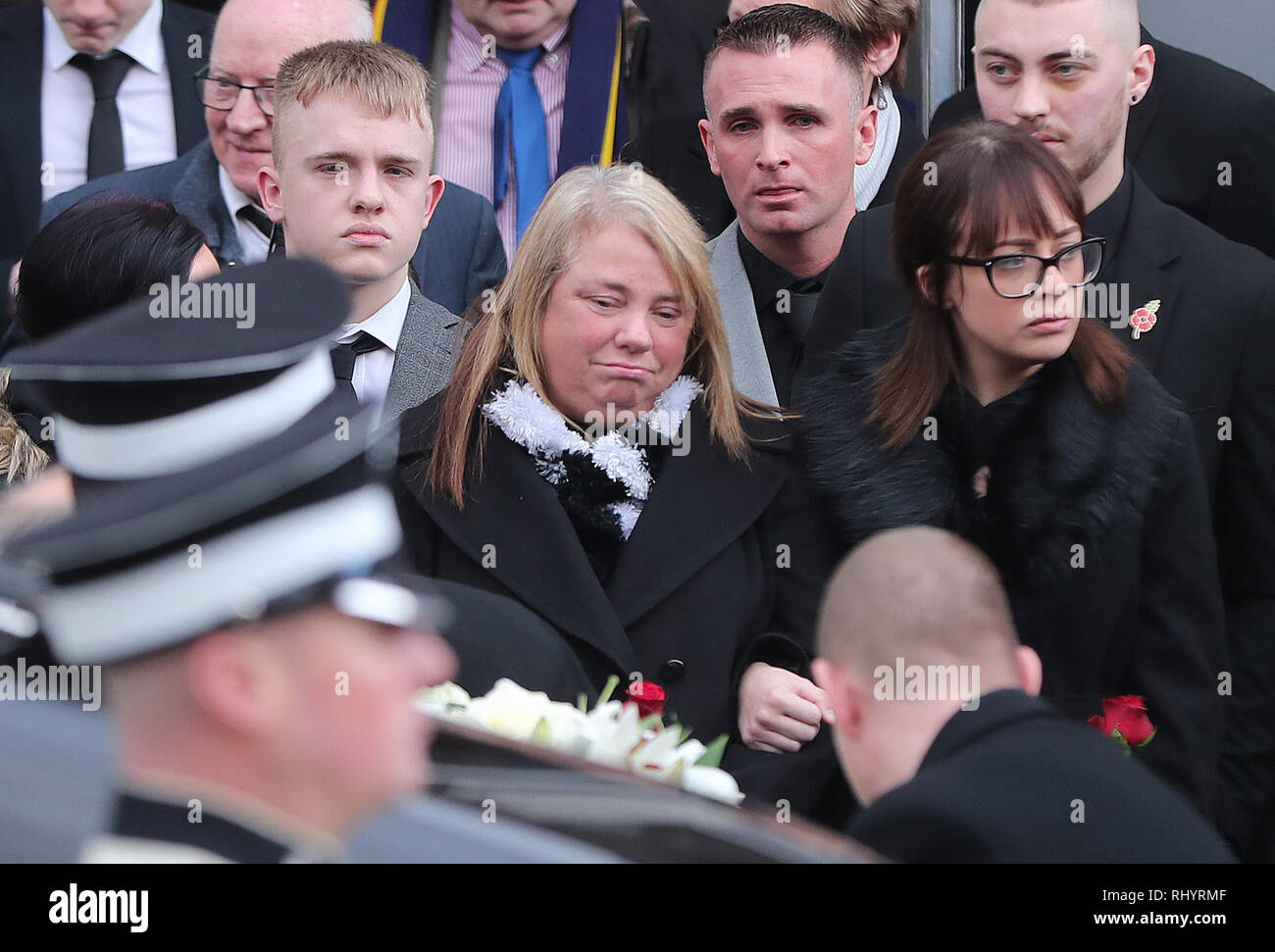 Ian Ogle's wife Vera is comforted following his funeral at the Covenant ...