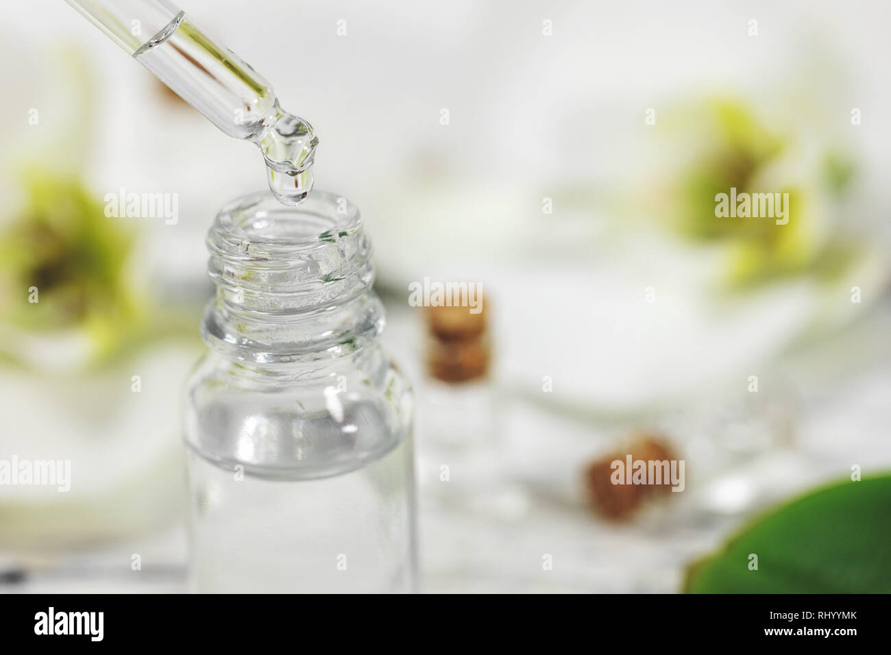 pipette with flower essential oil drop Stock Photo