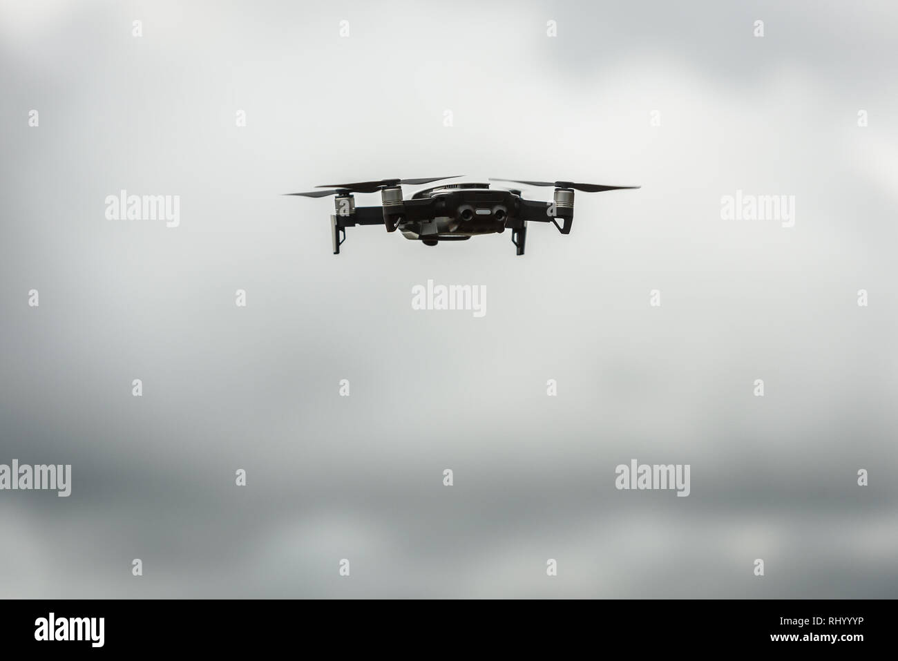 Drone quadcopter UAV with digital camera flying in the sky ...