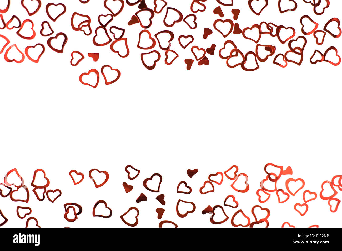 Little red confetti hearts on white background Stock Photo Alamy