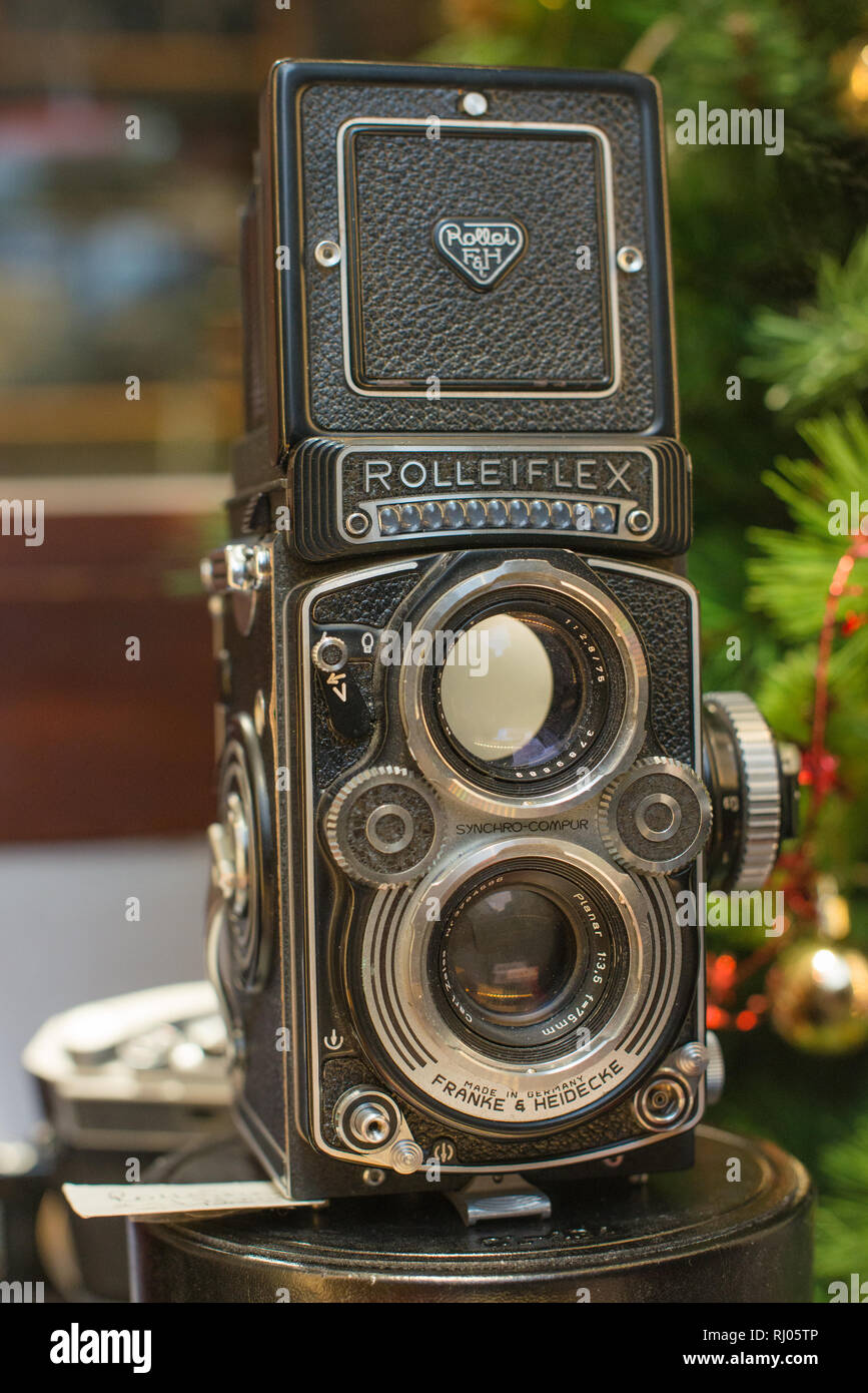A Rolleiflex 3.5E Planar TLR camera with viewing hood open and magnifier raised. Stock Photo