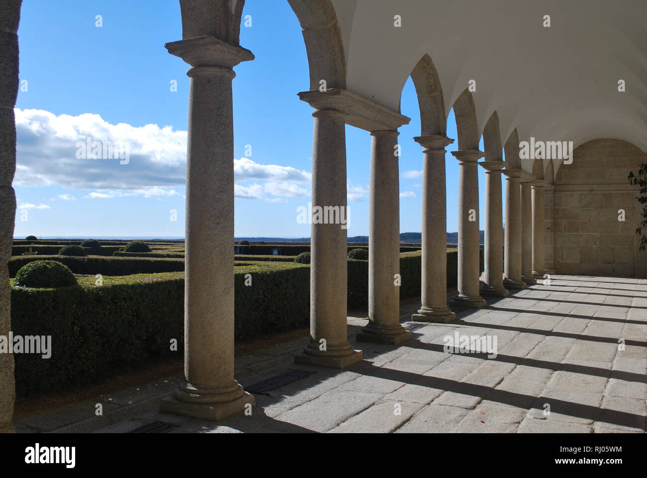 An arched walkway of the Royal Monastery in San Lorenzo de El Escorial, central Spain Stock Photo