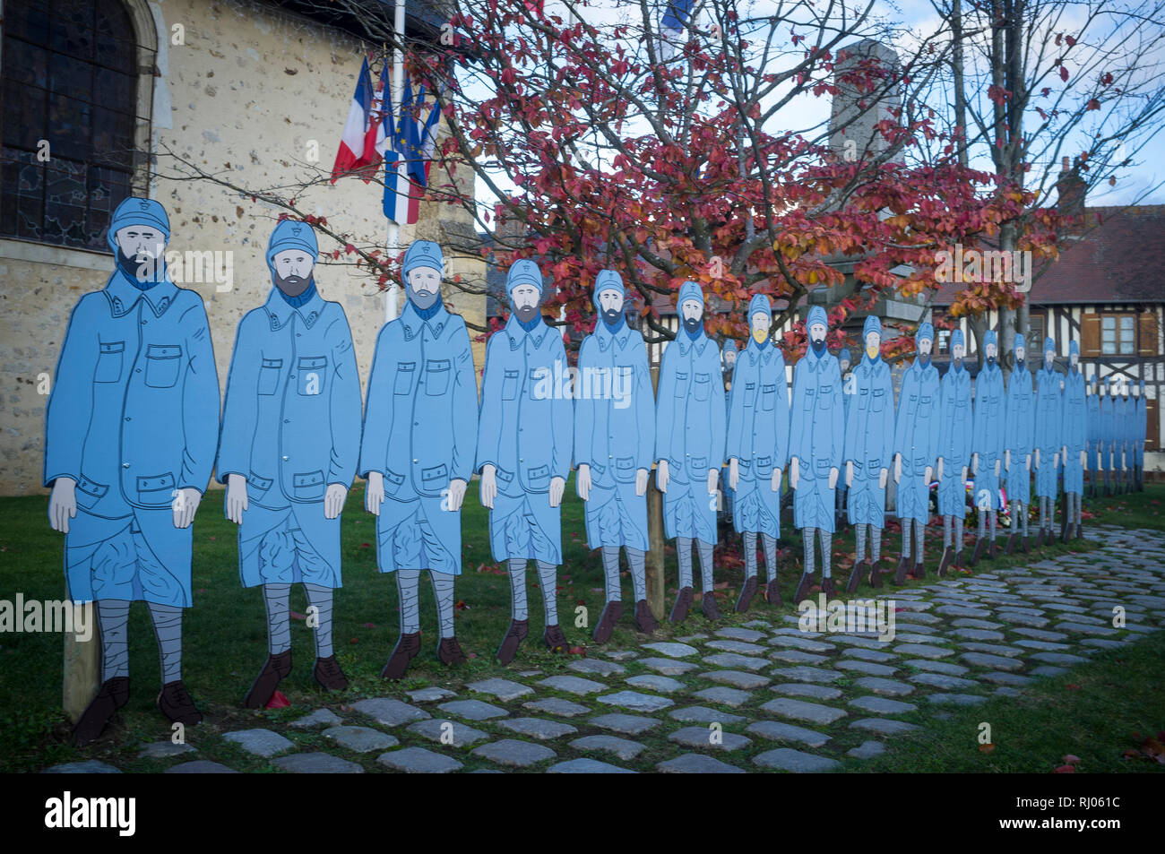 Effigies of fallen soldiers commemorate the 100th Anniverary of the start of the First World War by the Church in Moyaux, Normandy, France. Stock Photo
