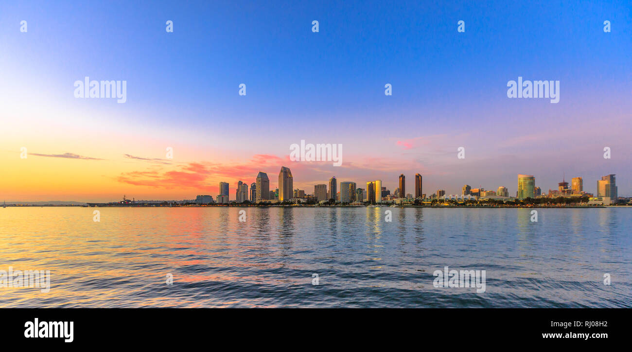 Scenic landscape with sunset colors sky of San Diego skyline with skyscrapers in San Diego Bay. Districts of Waterfront Marina skyline and urban Stock Photo