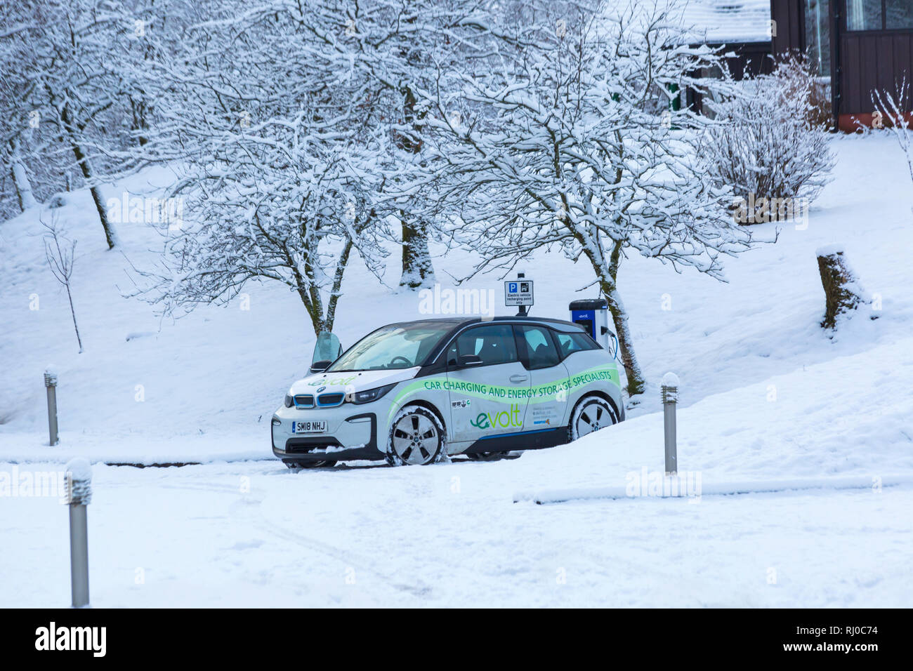 BMW Electric car being charged at electric car charging station point