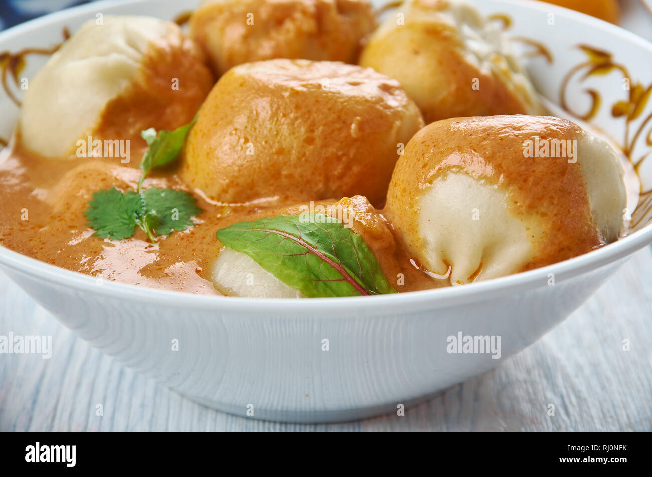 Mantu, Beef Dumplings. Afghani uisine, central Asia Traditional assorted dishes, Top view. Stock Photo