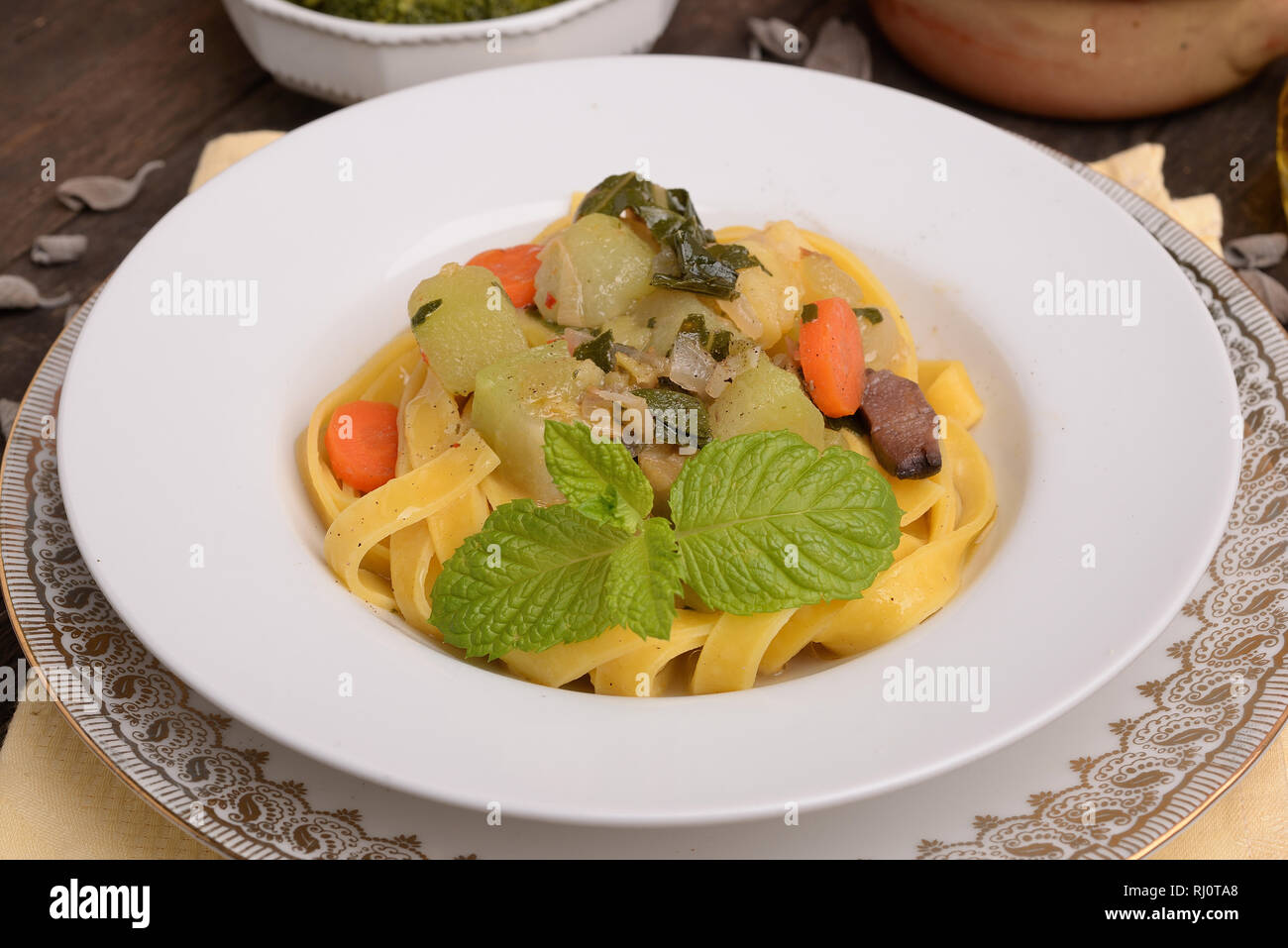 Tagliatelle with zucchini and carrots on the table thorny Stock Photo