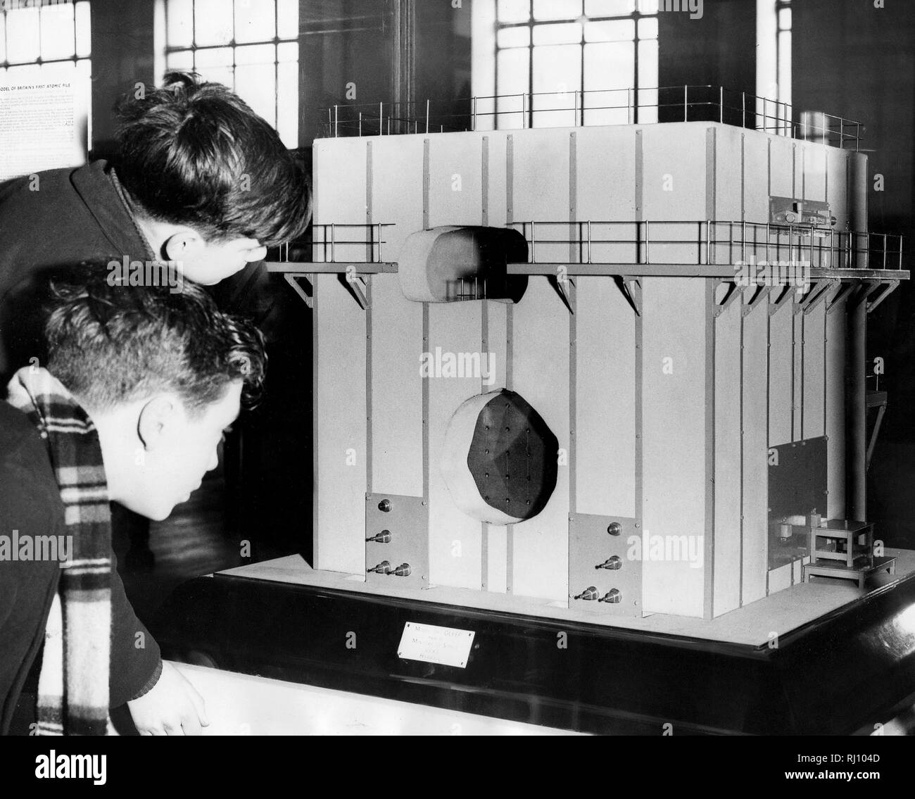 Photo Must Be Credited ©Alpha Press 050000 16/02/1950 Two school boys examine the model of the pile. Twentieth century Physics at the Science Museum in Kensington, London. A model of Britain's first atomic pile, The G.L.E.E.P. (Graphite Low Energy Experimental Pile) has been lent to the museum by the Ministry of Supply and is now on exhibition  on the second floor of the museum. Stock Photo