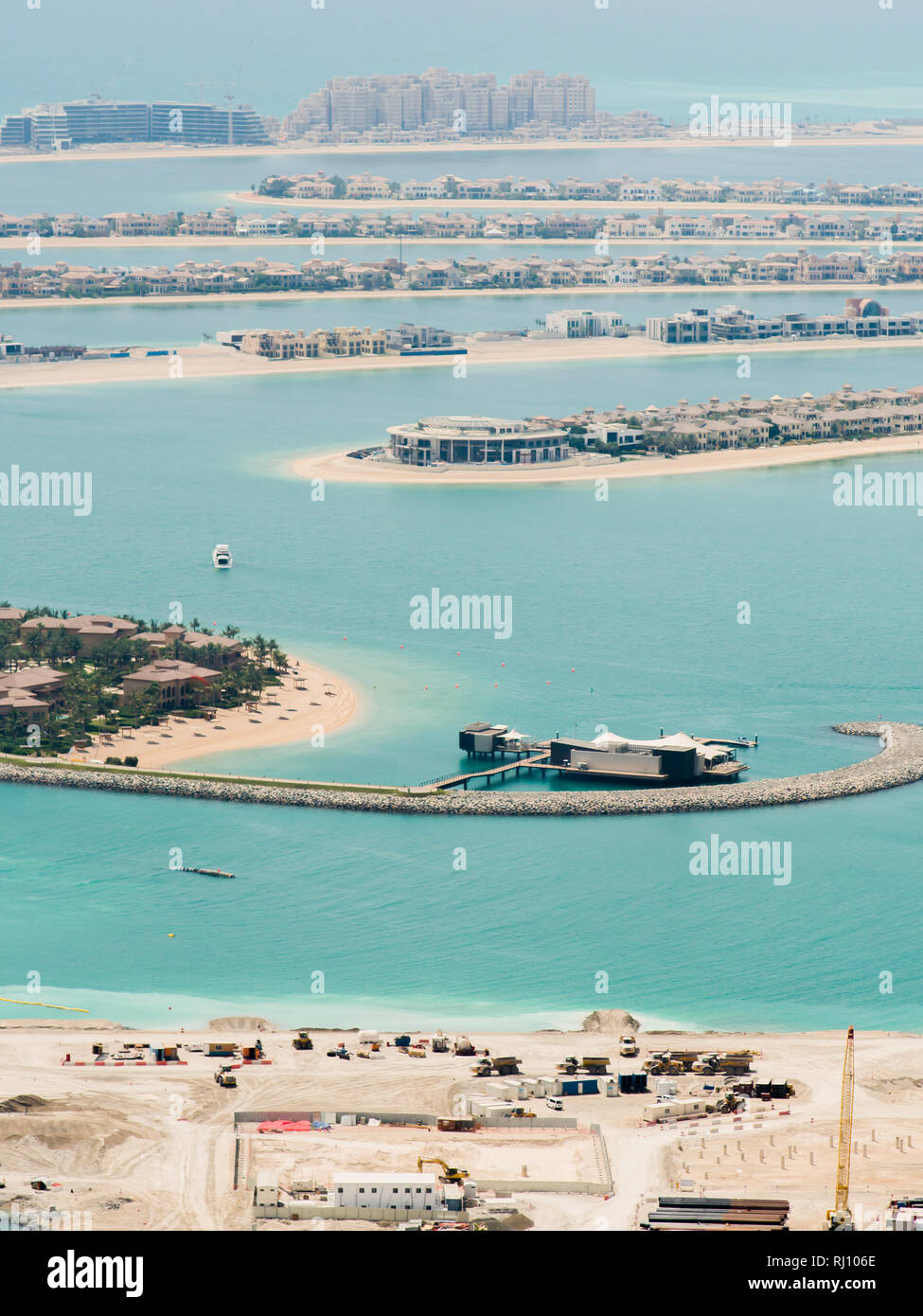 View on residential buildings on Palm Jumeirah island. The Palm Jumeirah is an artificial archipelago in Dubai emirate. Stock Photo