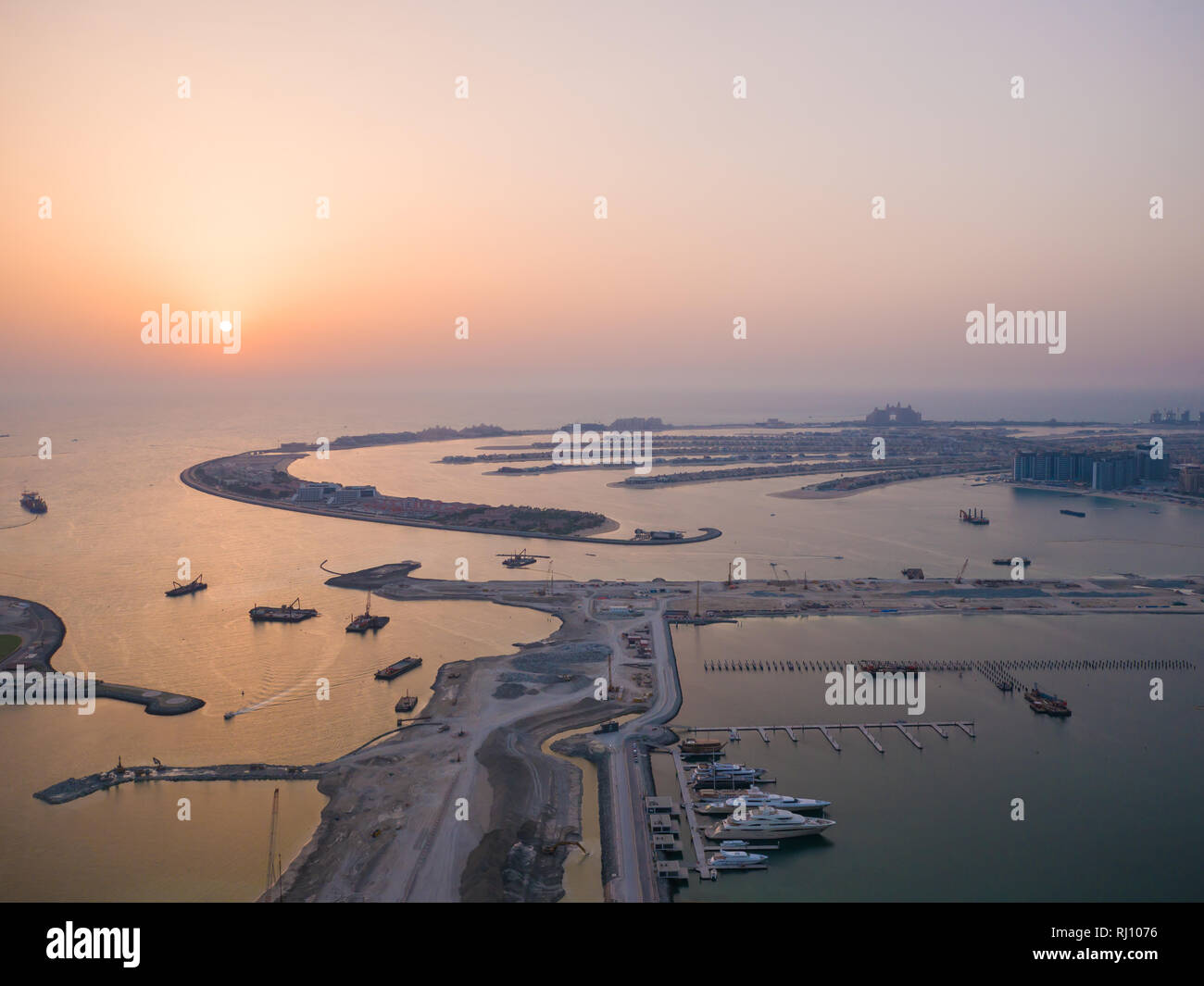 Sunset and night over the artificial islands of Dubai. Timelapse. Stock Photo