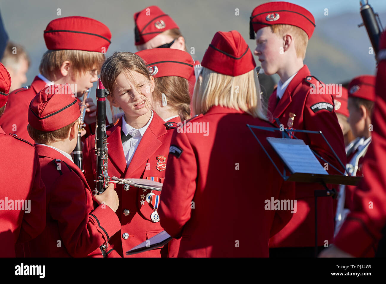 Harstad School Band (Kanebogen Skolekorps) Playing On The Deck Of The MS TROLLFJORD, As It Departs Risøyhamn, Andøya, Norway. Stock Photo