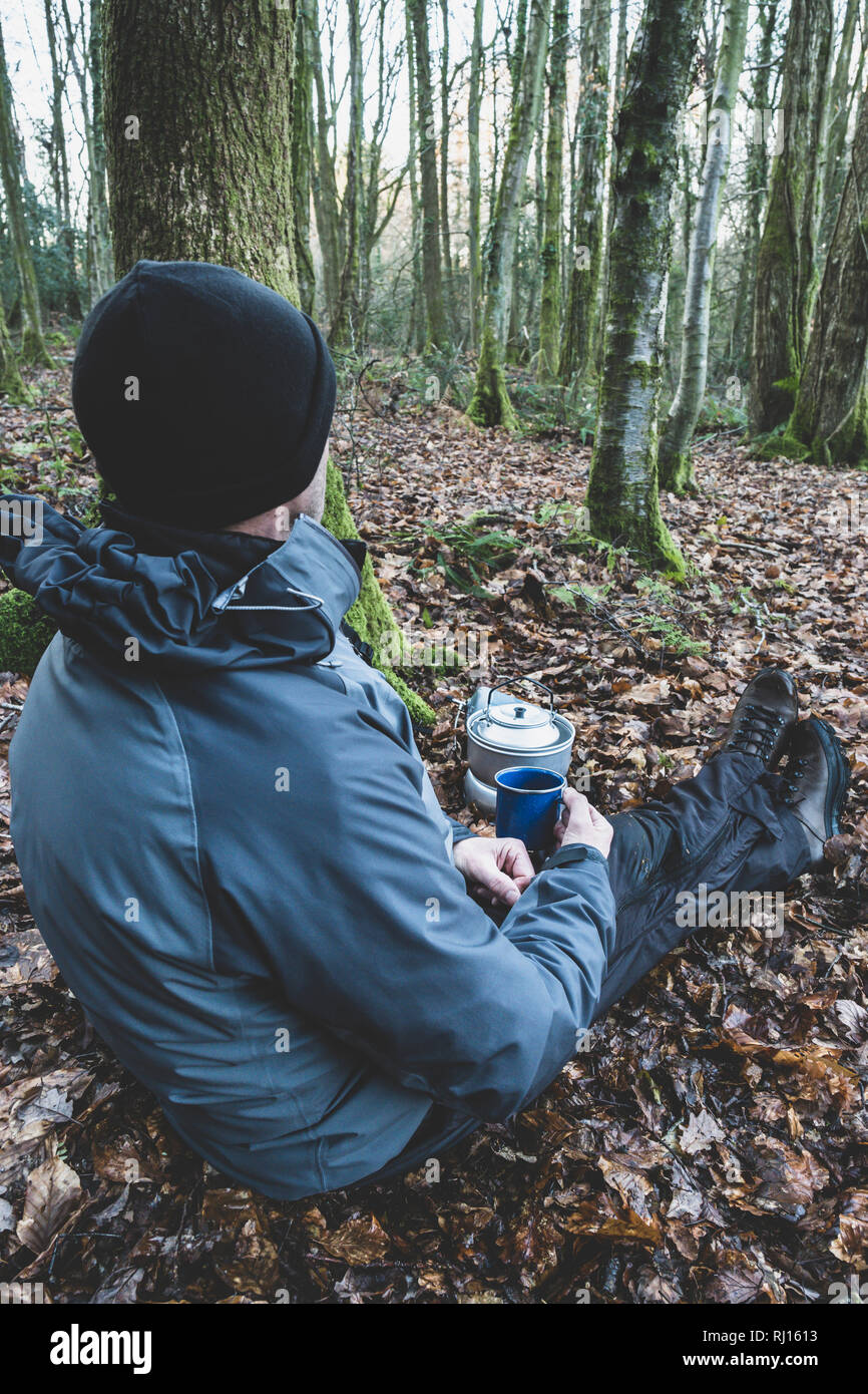 A man sitting in the woods. Stock Photo