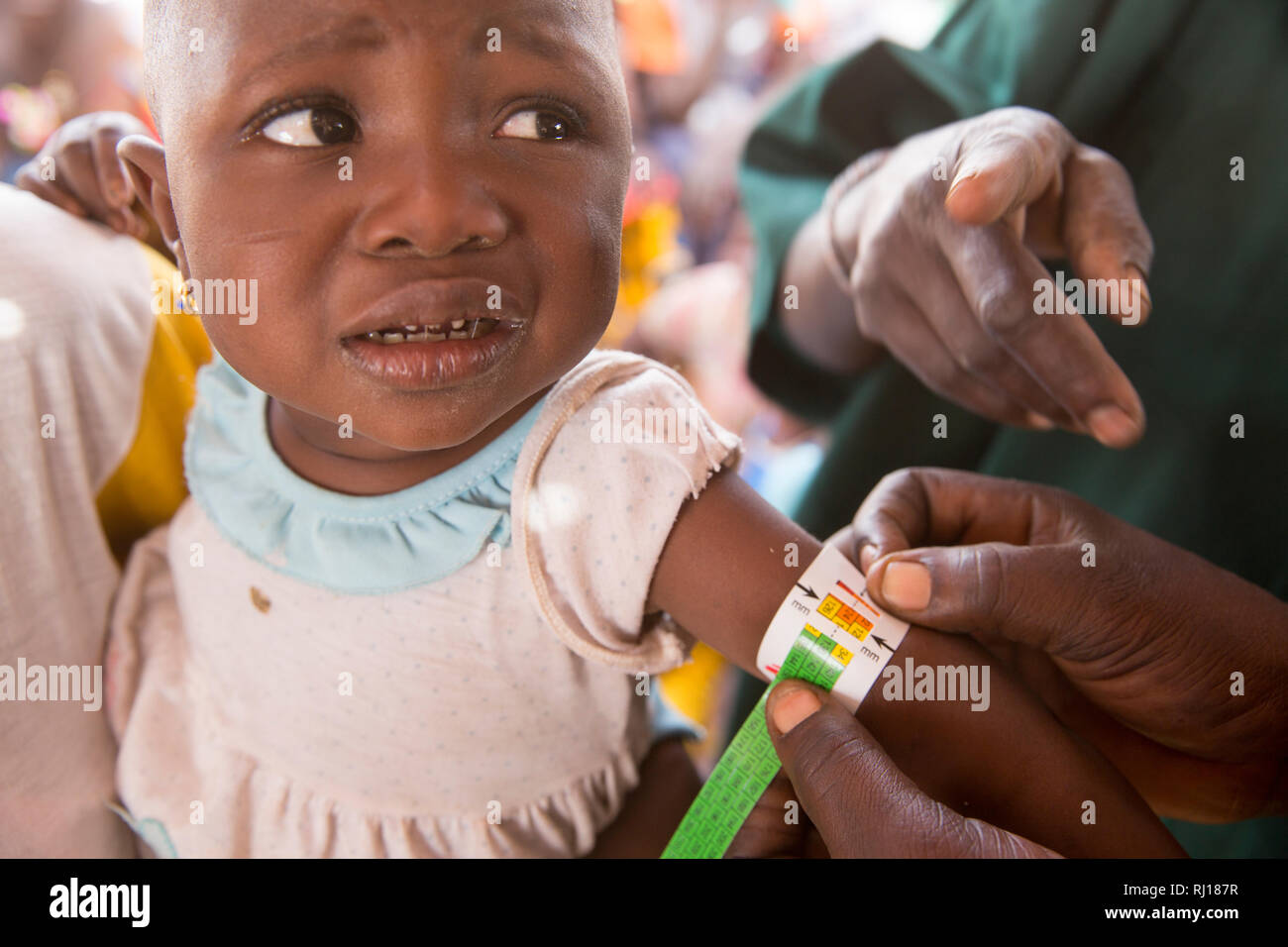 Samba village, Yako Province, Burkina Faso. CVN nutition team check children for signs on malnutition. Stock Photo