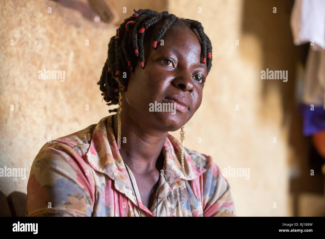 Samba village, Yako Province, Burkina Faso. Salamata Zoundi, 27, mother of two year old triplets at her home. Stock Photo