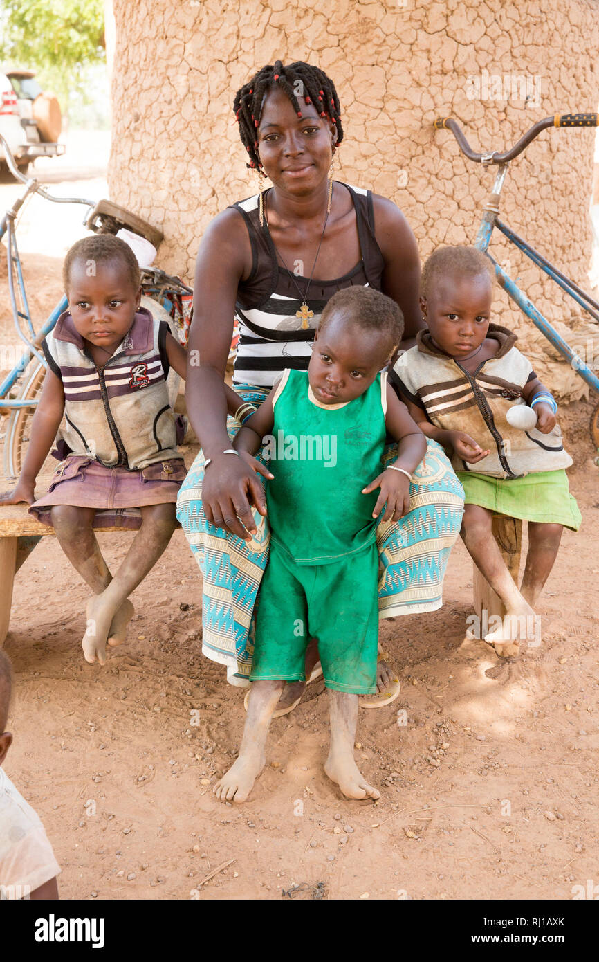 Samba village, Yako Province, Burkina Faso; Salamata Zoundi, 27, with her tiplets Christelle,  Christine and Christophe, aged 2. Stock Photo