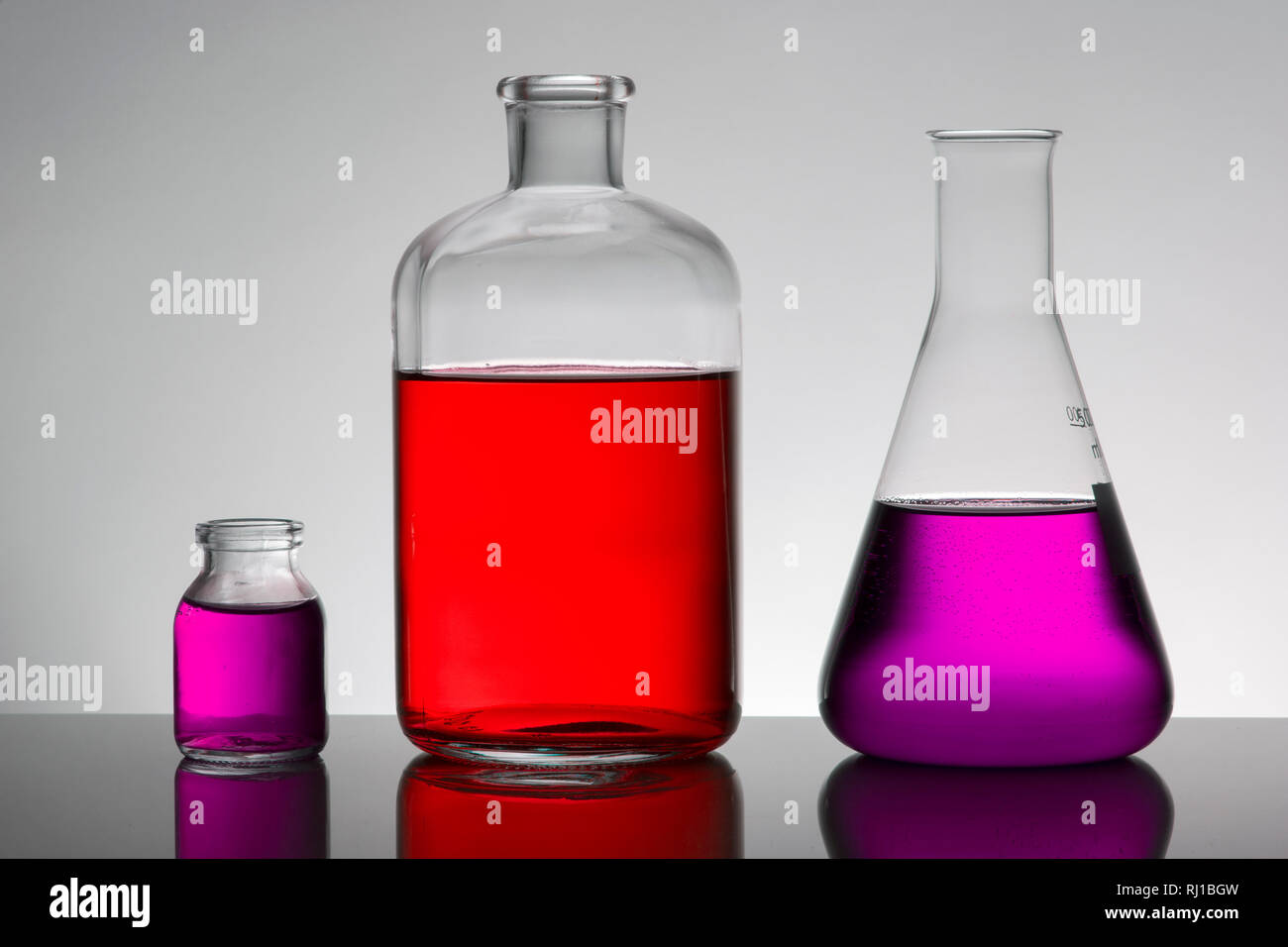 Liquid in laboratory bottles. Scientific biochemical laboratory ...