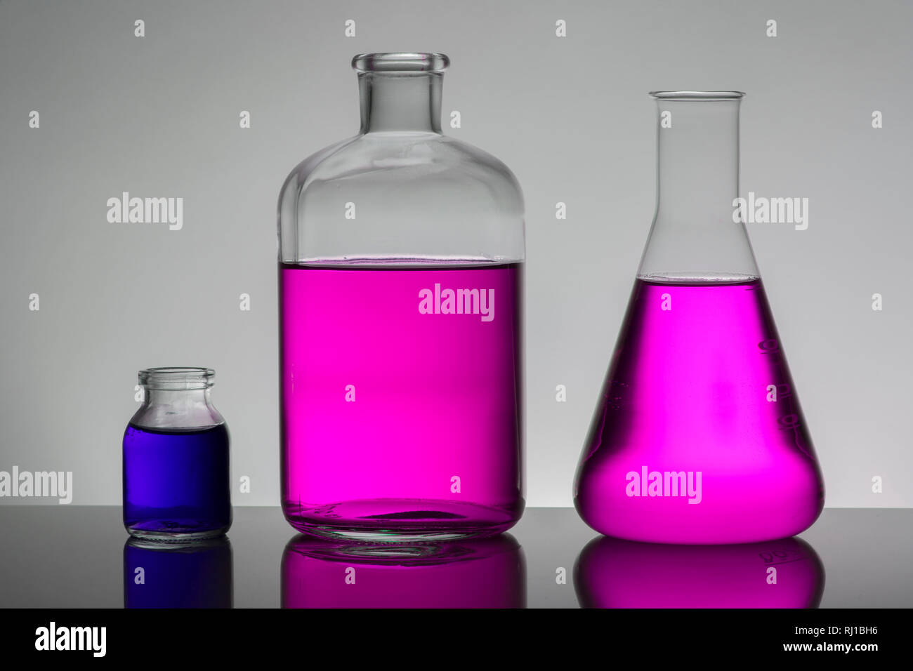 Liquid in laboratory bottles. Scientific biochemical laboratory ...