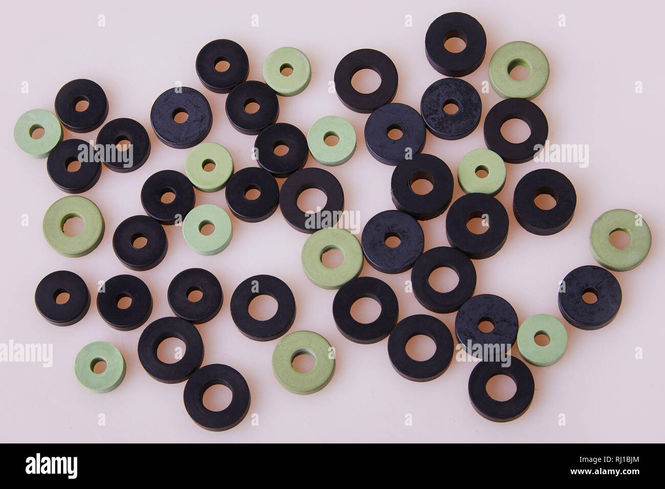 Colorful water level rubber gaskets scattered on the table. Top viev