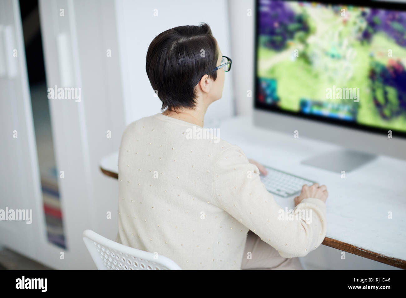 Woman Working in White Office Stock Photo