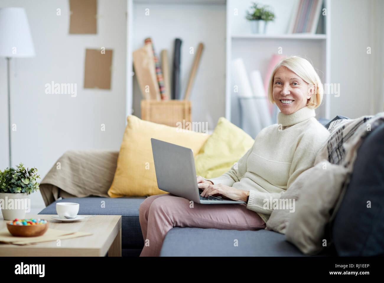 Mature Woman Using Laptop Stock Photo