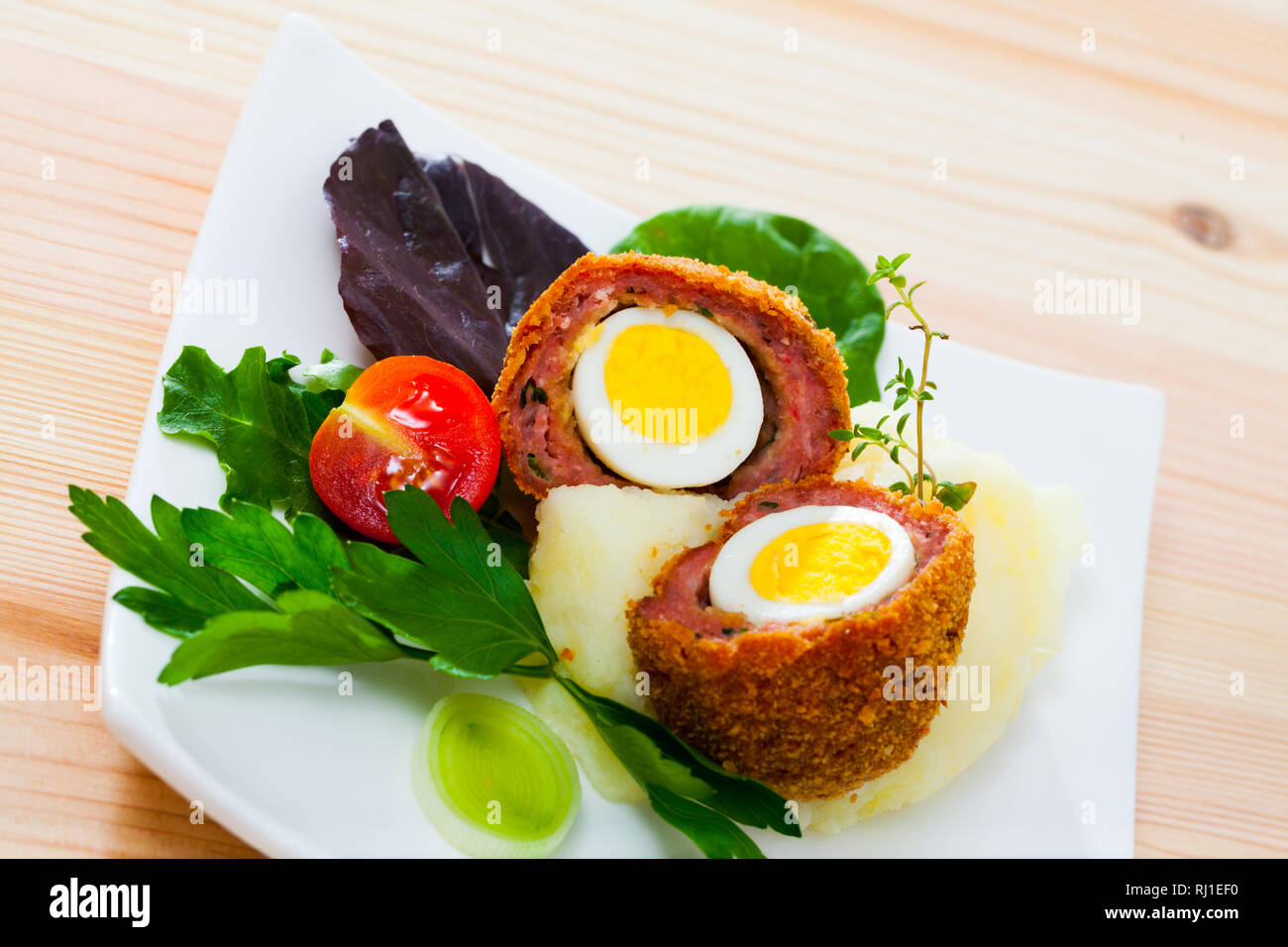 Hardboiled quail egg wrapped in sausage meat, breaded and fried