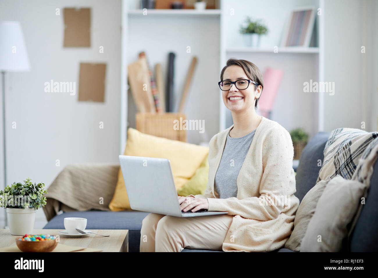 Smiling Businesswoman Using Laptop Stock Photo