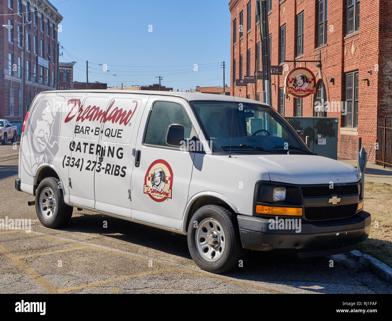 Dreamland BBQ or barbecue catering delivery truck parked with the business sign in background in Montgomery Alabama, USA. Stock Photo