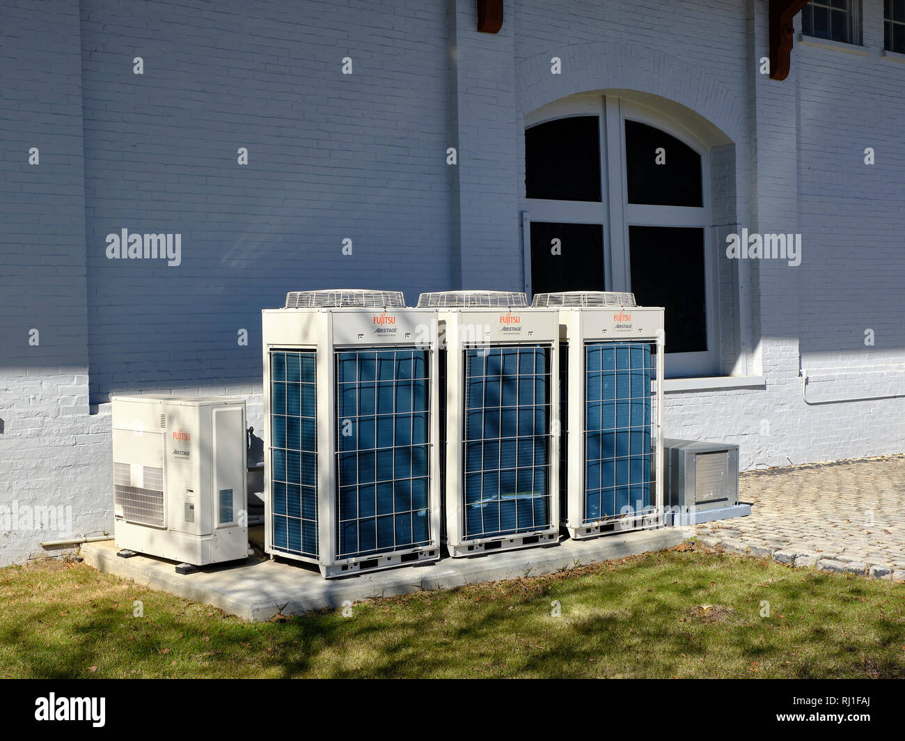 Multiple Fuji Airstage Inverter or heat pump units used to heat and cool a commercial building in Montgomery Alabama, USA. Stock Photo