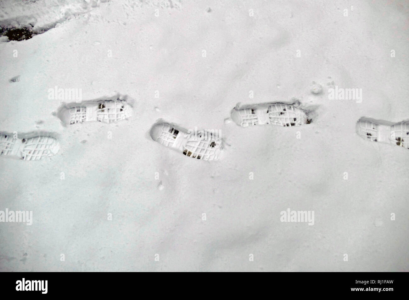 Footprints in the snow Stock Photo Alamy