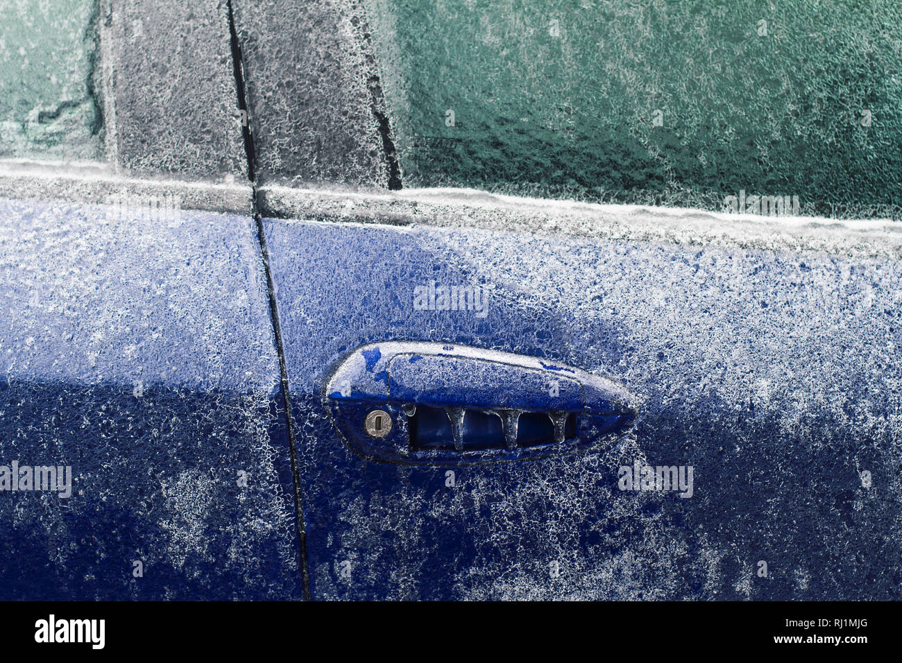 Front View Closeup Of Blue Car Door Lock And Handle Frozen