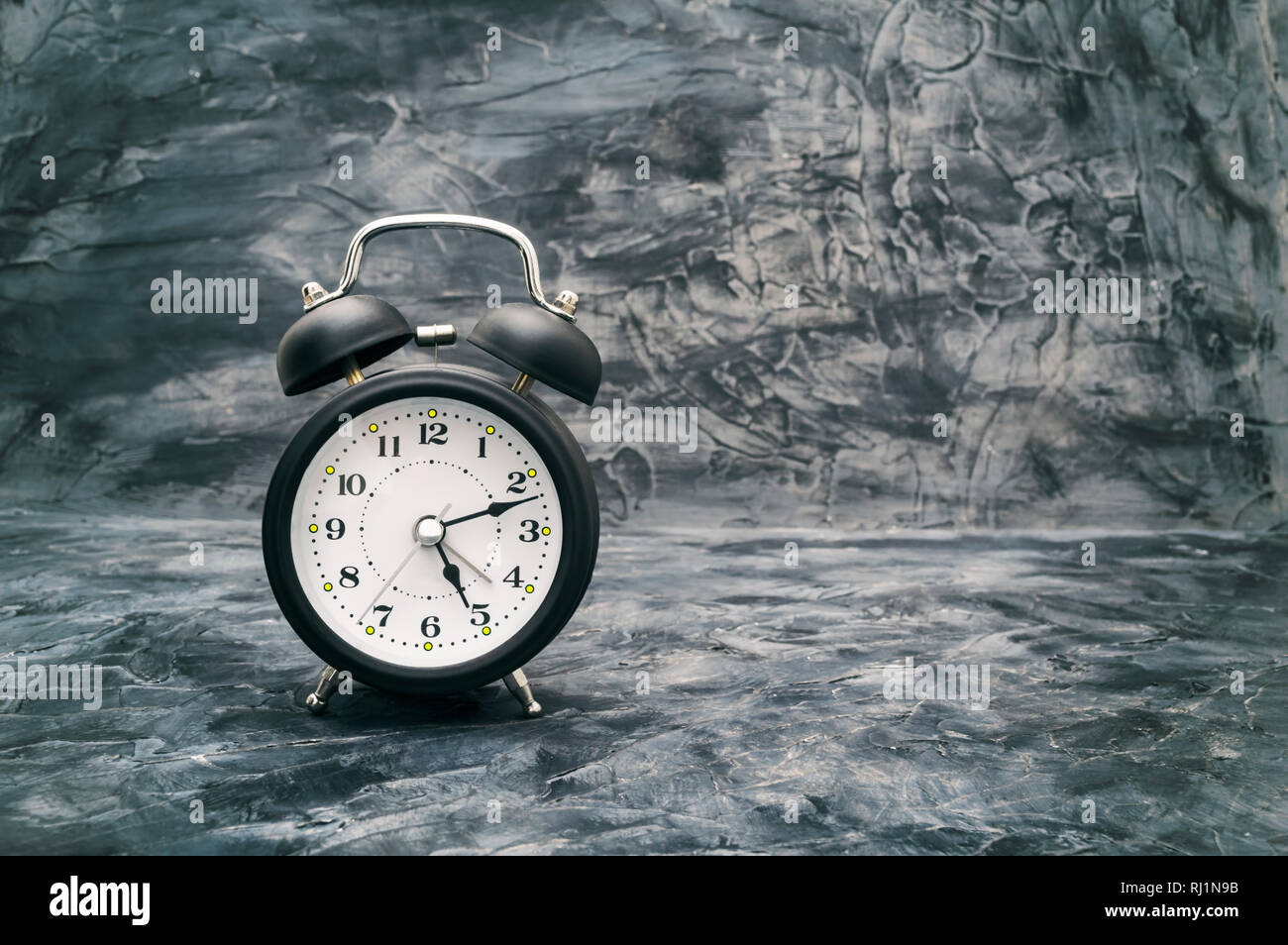 Classic alarm clock on vintage dark background, time is running out concept  Stock Photo - Alamy