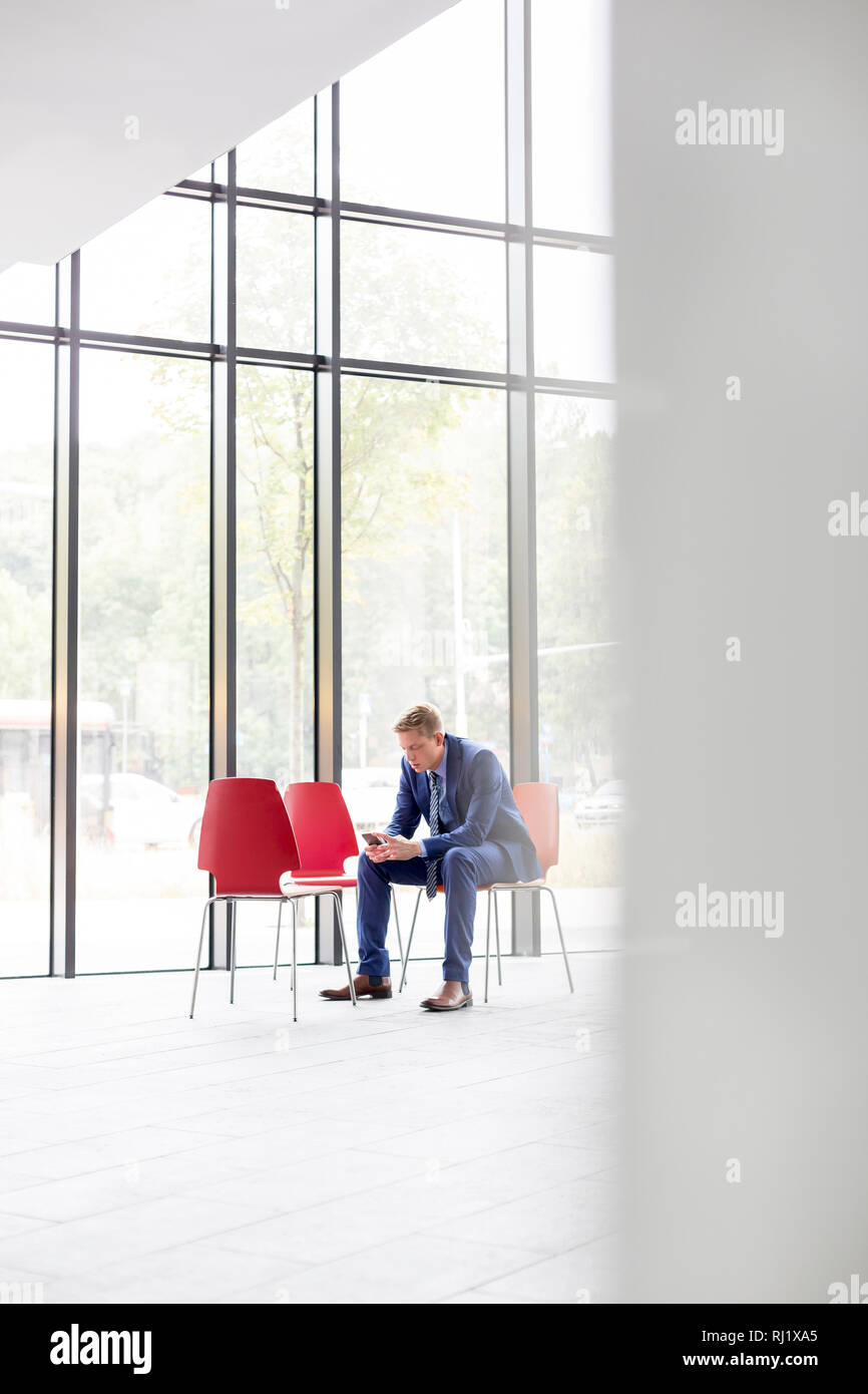 Man sitting chair full length hi-res stock photography and images - Alamy