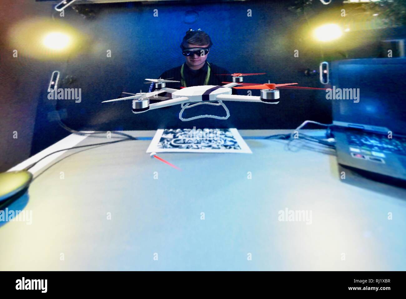 Using Magic Leap One mixed reality goggle for Mimesys debut of holographic collaboration as 2 people build drone at Intel booth at CES, Las Vegas, USA Stock Photo