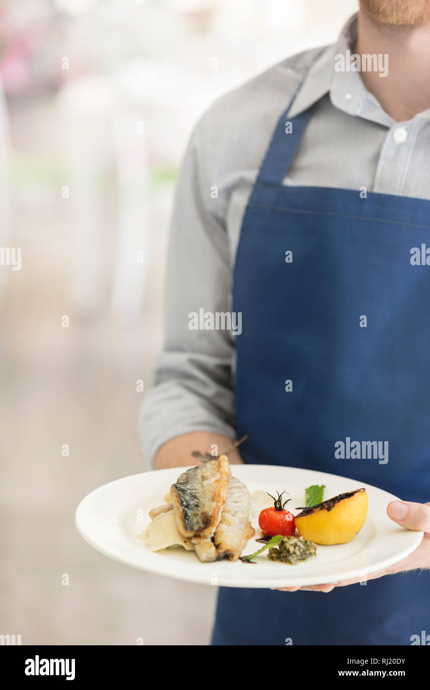 Waiter serving food restaurant hires stock photography and images Alamy