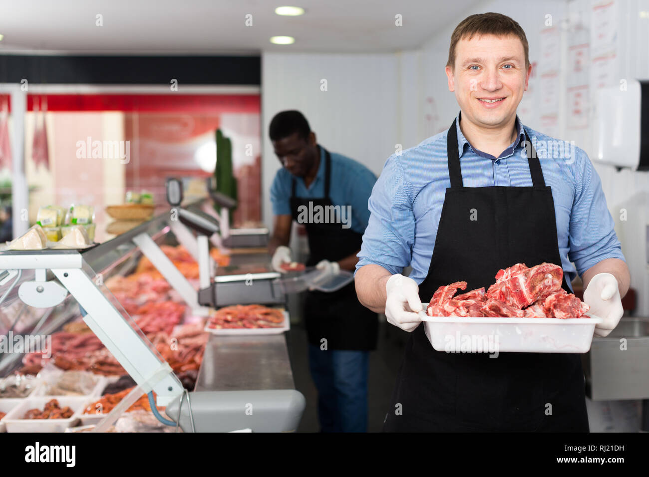 Butchers preparing minced meat hi-res stock photography and images - Alamy