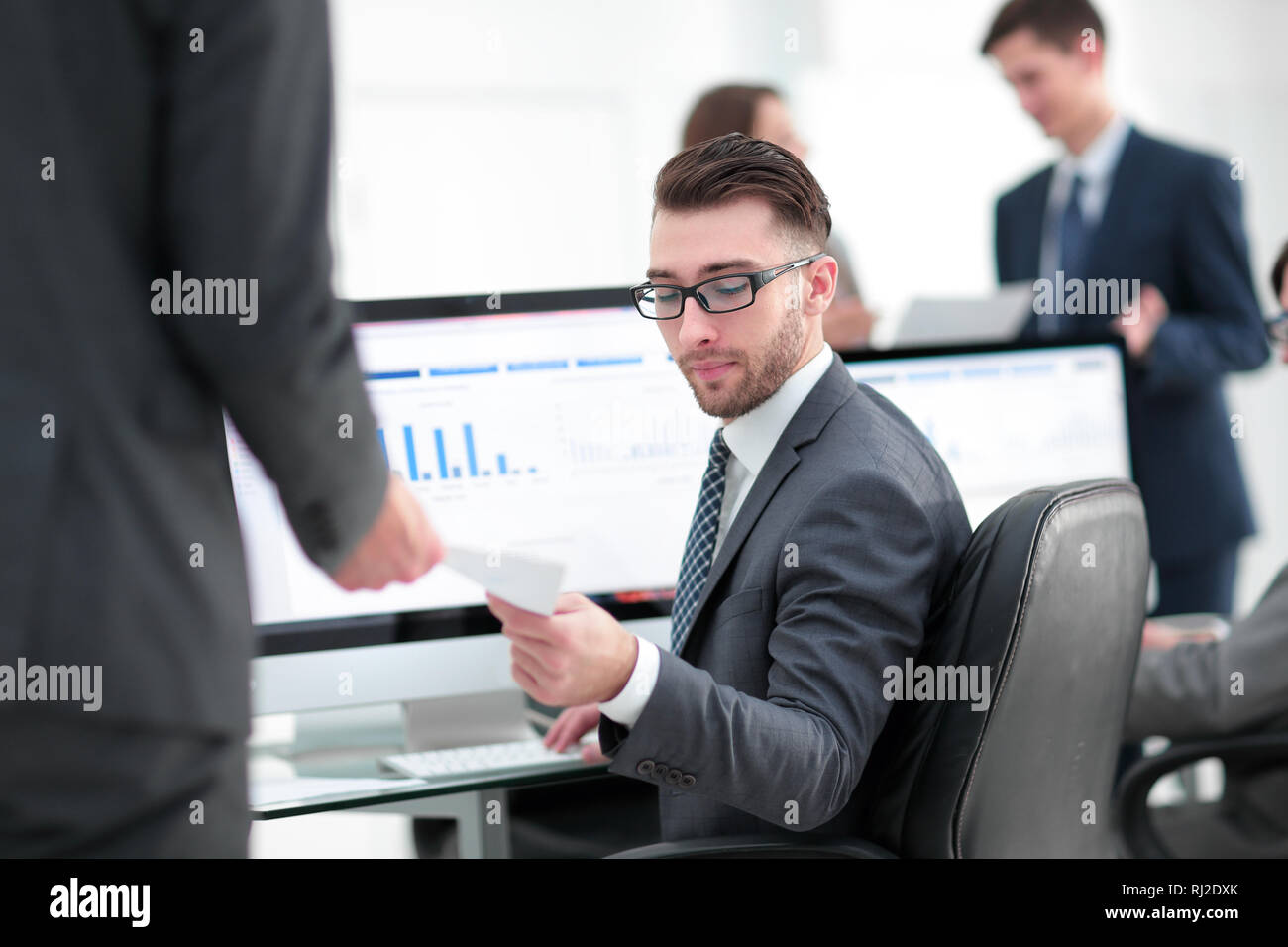 businessman working on a computer on business reports Stock Photo