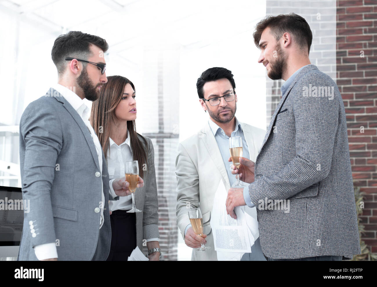 close up.business people raising glasses with wine. Stock Photo