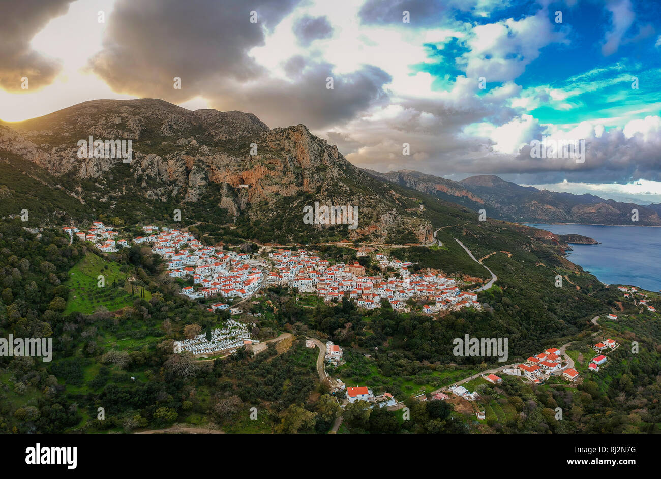 the Historical Byzantine village Velanidia near cape Malea, Greece. In the Cave above the village is visible the Holy Monastery of Zoodochos Pighi. Stock Photo