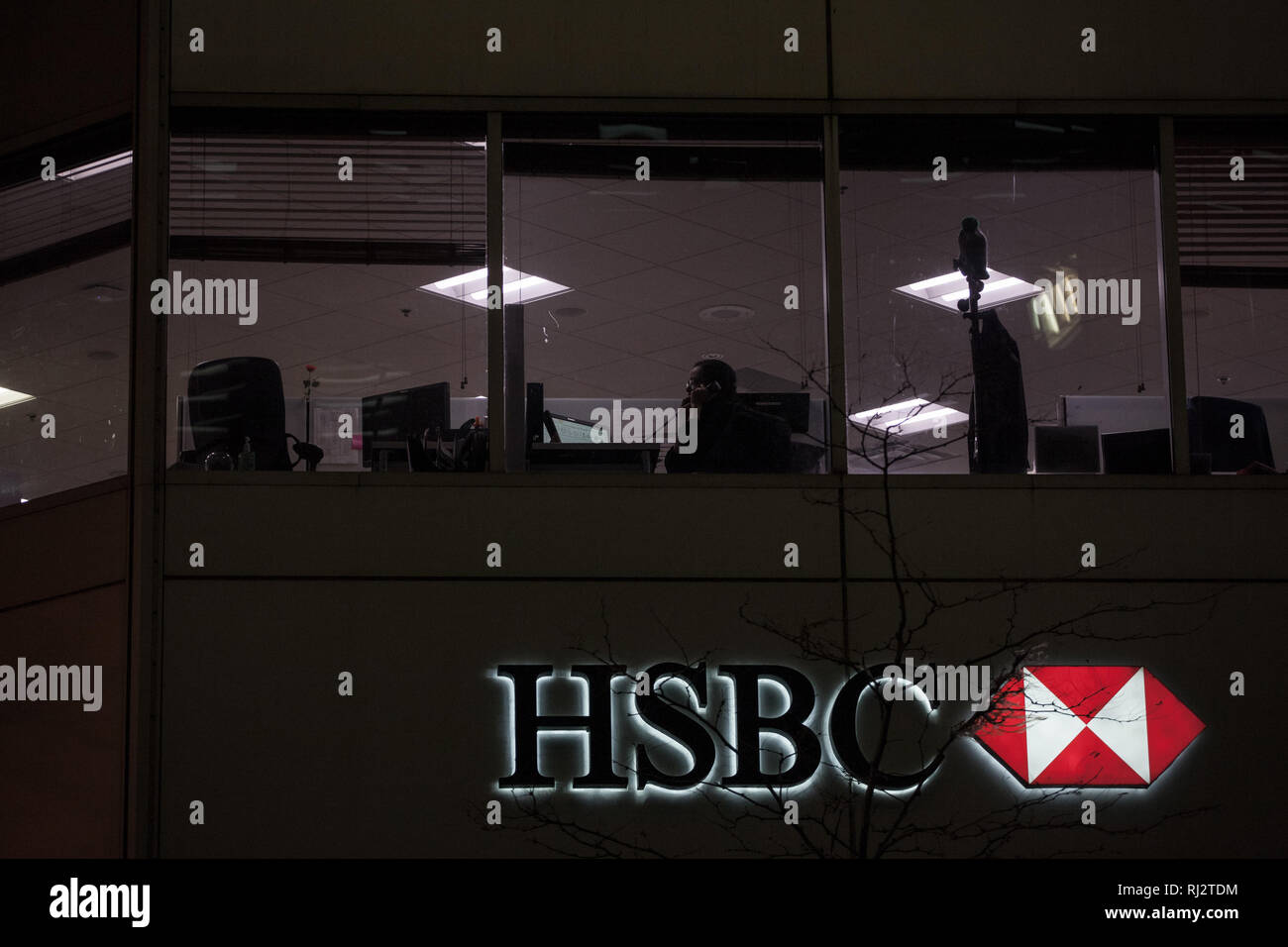 MONTREAL, CANADA - NOVEMBER 8, 2018: Logo of the HSBC Bank, on their main branch in Montreal at night. HSBC is a british bank spread worldwide  Pictur Stock Photo