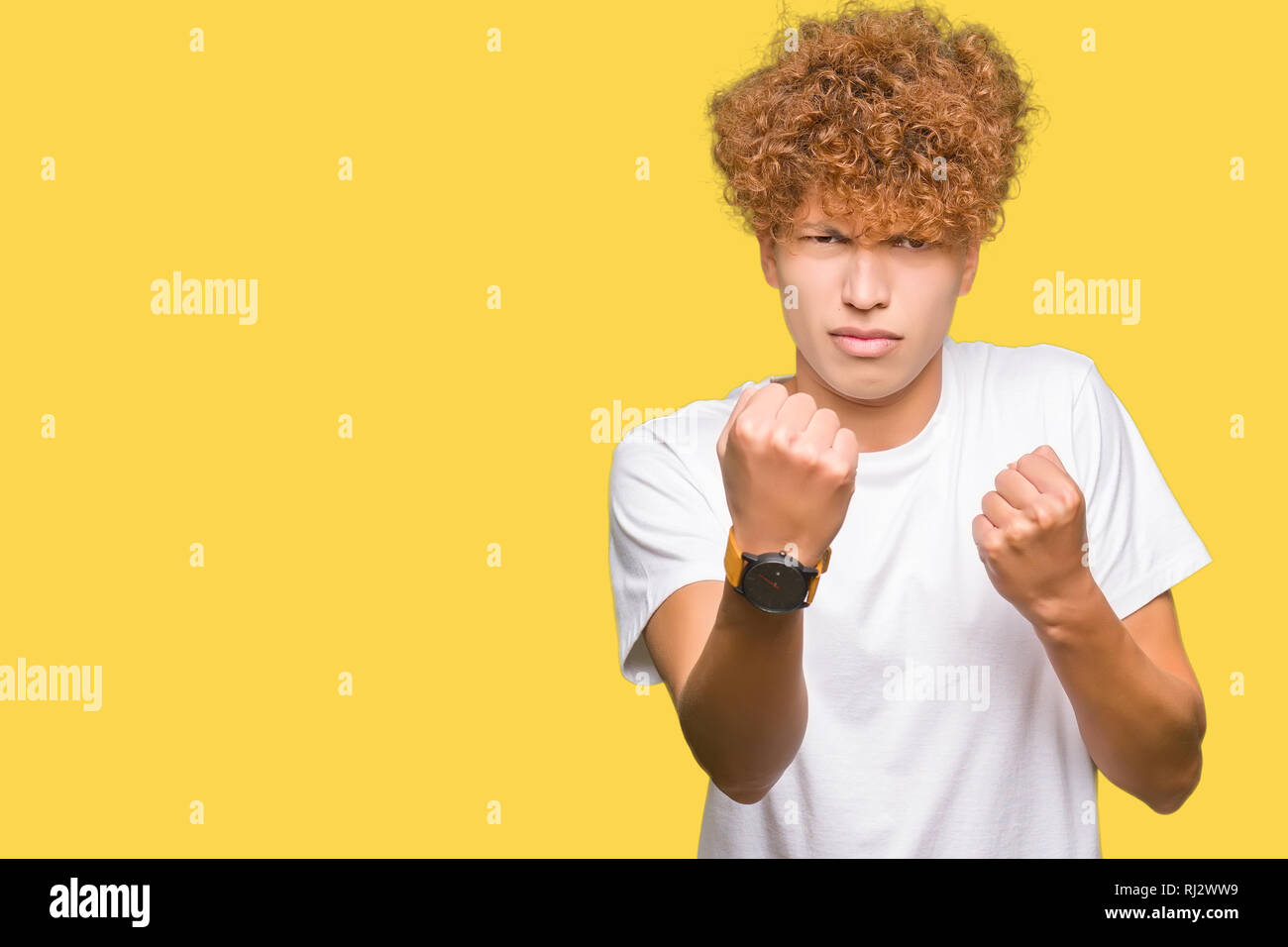 Young Handsome Man With Afro Hair Wearing Casual White T Shirt