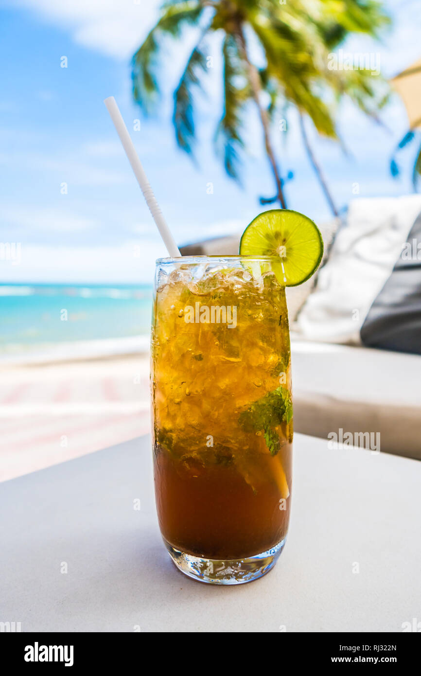 https://c8.alamy.com/comp/RJ322N/mocktail-glass-with-beach-and-sea-background-RJ322N.jpg