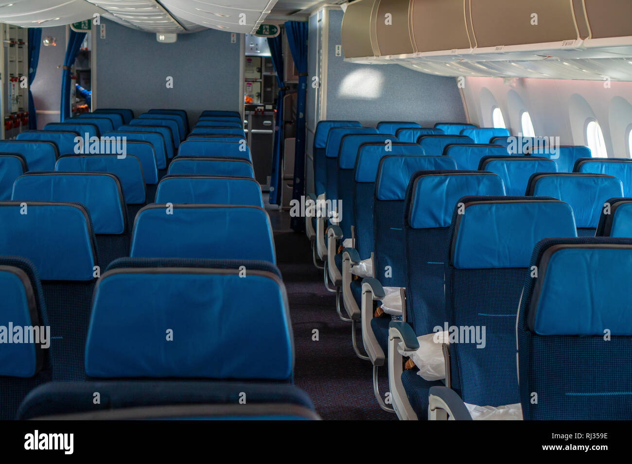 blue empty seats inside an airplane Stock Photo