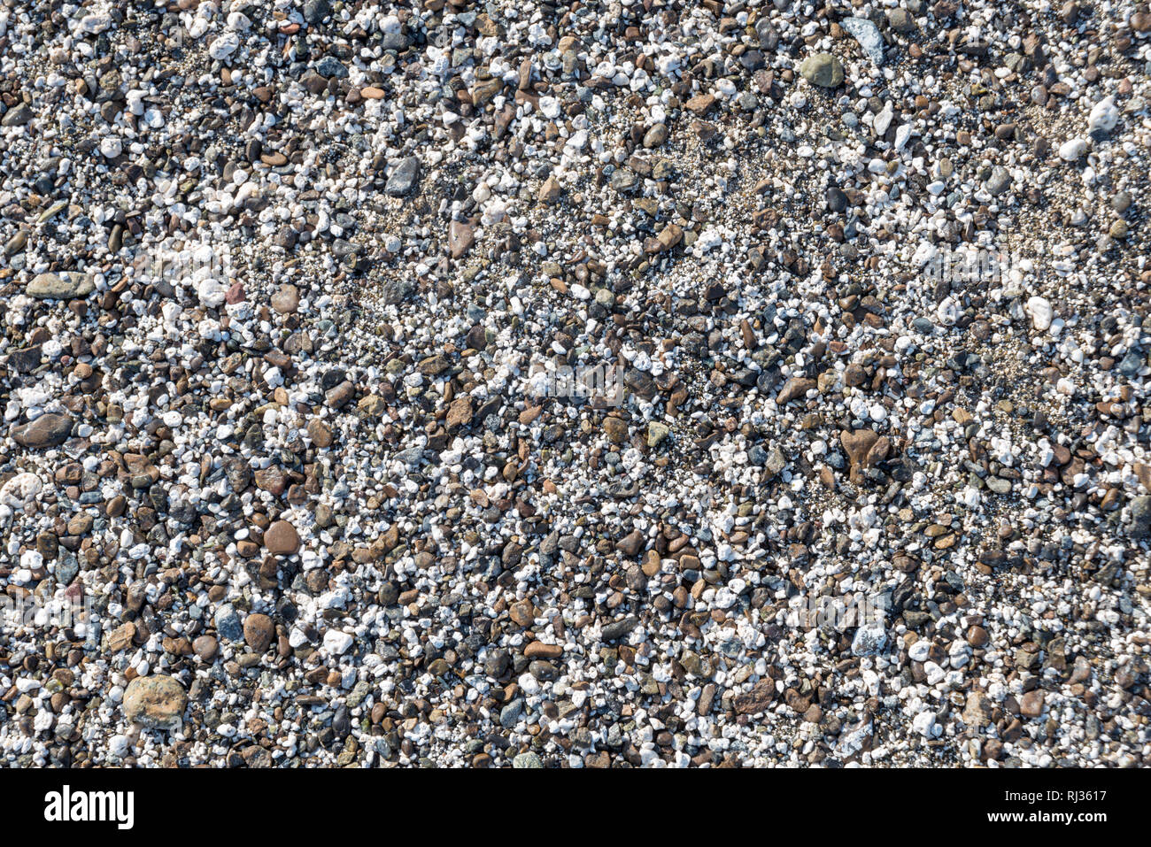 Gravels at the beach side for background Stock Photo - Alamy