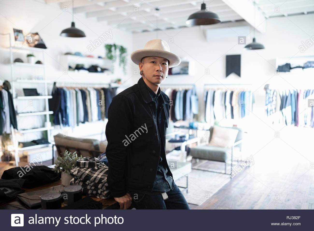 Portrait confident male business owner in menswear clothing shop Stock ...