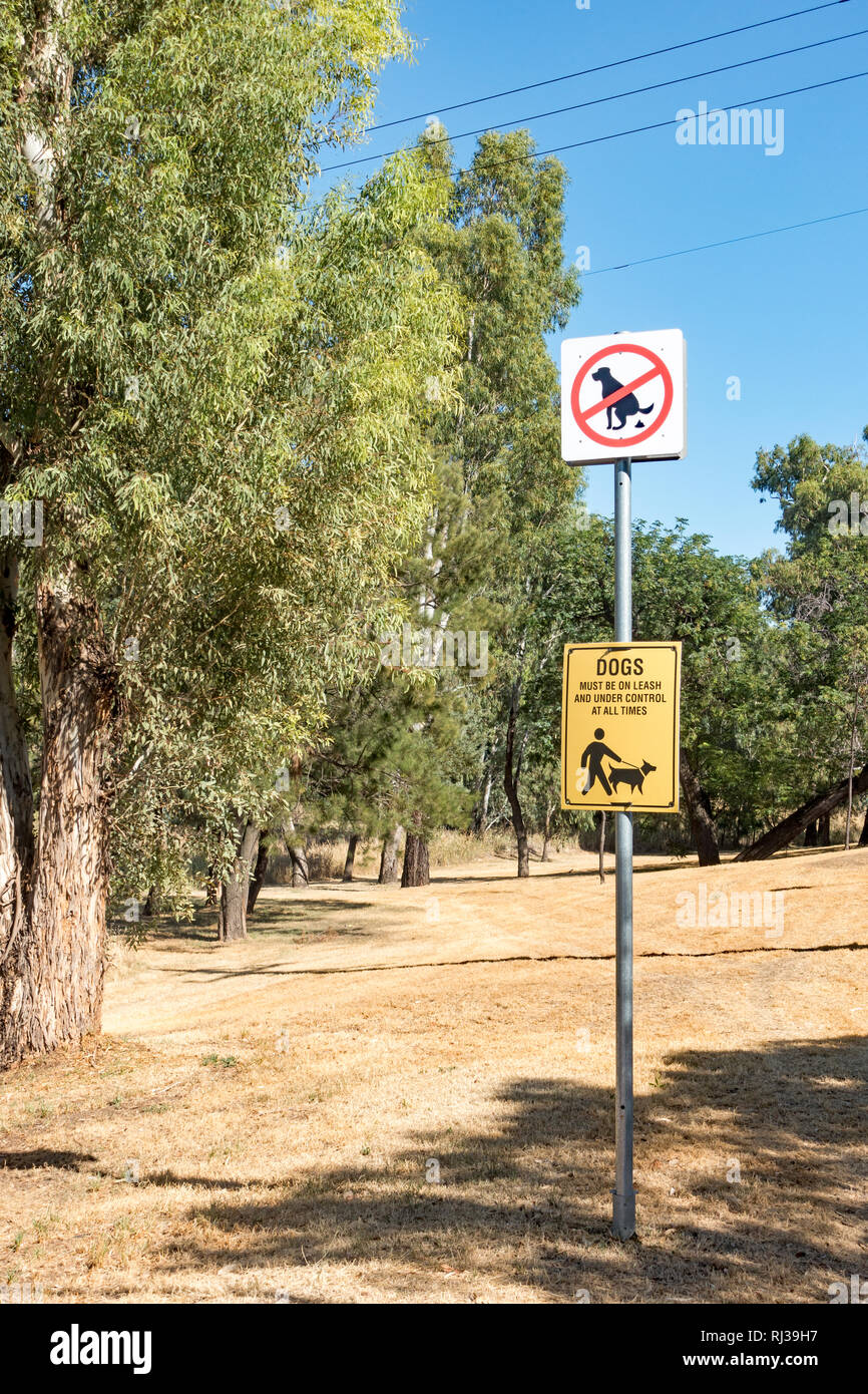 Signs advising owners to keep their dog on a lead and to clean up their excrement, Tamworth Australia. Stock Photo