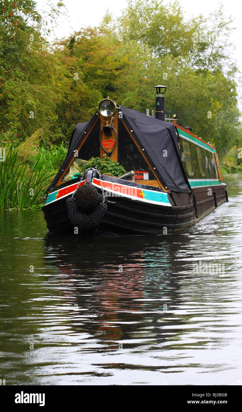 black and green narrow boat on canal Stock Photo