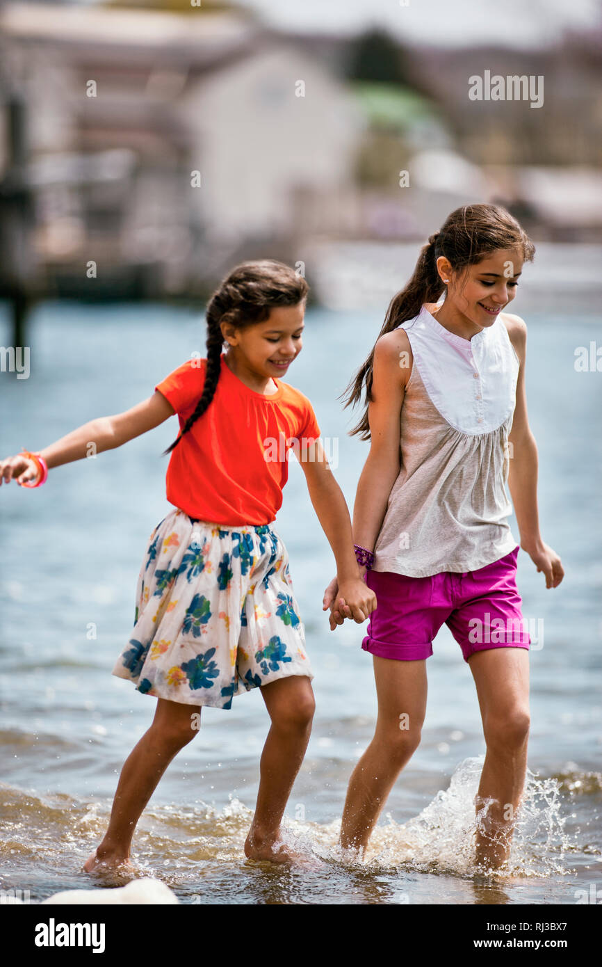 Siblings holding hands in color hi-res stock photography and images - Alamy